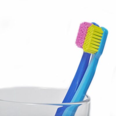 Colorful toothbrushes in a glass