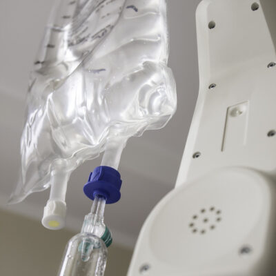 Close up of a infusion and SOS telephone in hospital